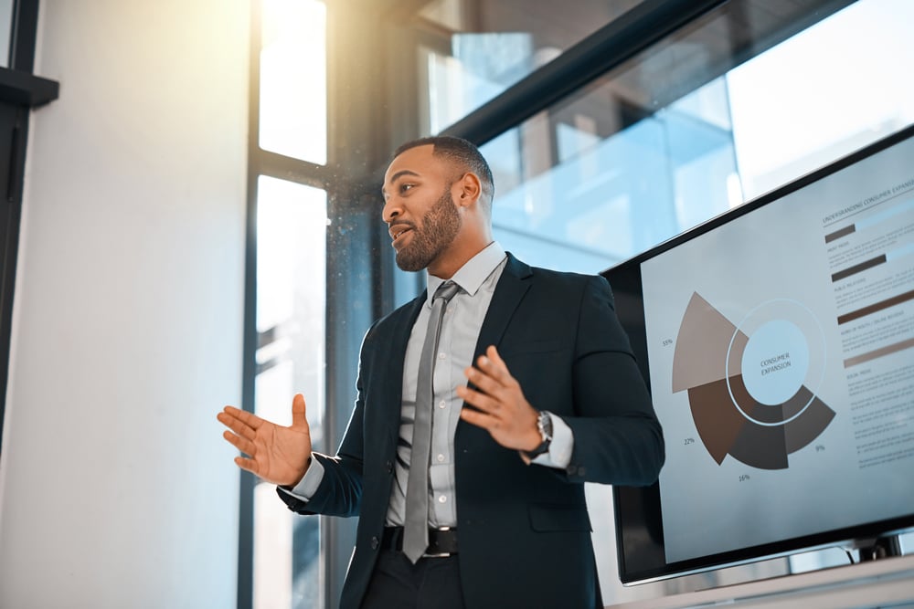 Business man standing up giving a presentation